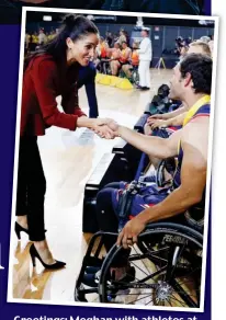  ??  ?? Greetings: Meghan with athletes at the 2018 Invictus Games in Sydney