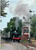  ?? ?? No. 553 takes the iron ore tipple train past the ‘new’ Boughton signalbox, an LNWR structure of 1875 from Betley Road in Staffordsh­ire. DR TONY STEAD