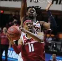  ?? (AP/Sue Ogrocki) ?? Senior guard Jalen Tate has played a key role in the Razorbacks’ four-game winning streak since their loss to Oklahoma State on Jan. 30. He has averaged 12.2 points in those games and scored 15 to lead Arkansas past Kentucky on Feb. 9.