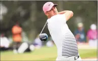  ?? Mike Ehrmann / Getty Images ?? Brooks Koepka plays his shot from the third tee during the second round of the Masters at Augusta National Golf Club on Friday.