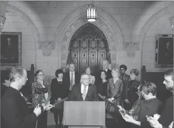  ?? CP PHOTO ?? Minister of Public Safety and Emergency Preparedne­ss Ralph Goodale is surrounded by cabinet and caucus members on Parliament Hill as he makes an announceme­nt on firearms legislatio­n.