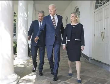  ?? Oliver Contreras Sipa ?? FINNISH President Sauli Niinisto, left, President Biden and Swedish Prime Minister Magdalena Andersson talk Thursday in Washington. Nearly 16 months into his tenure, Biden arrives Friday for his first trip to Asia.