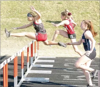  ??  ?? Junior Lady Blackhawk Shelby Dunlap took first place in the 100 meter hurdles with a time of 16.49.