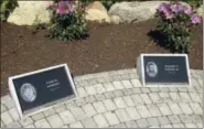  ?? MICHELLE R. SMITH — ASSOCIATED PRESS ?? Plaques honoring victims comprise a memorial in West Warwick, R.I., on Friday, May 19, at the site of The Station nightclub fire that killed 100 and injured more than 200 people in 2003.