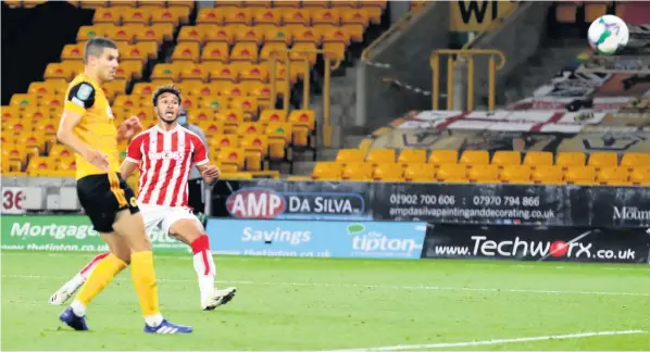  ??  ?? WHAT A WINNER!: Jacob Brown scores his first goal for the Potters as they beat Wolves in the second round of the Carabao Cup last night.
All pictures by PA Photo.