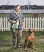  ??  ?? Above: Polly Mazzarella and Trigger, still smiling despite receiving the Naughtiest Gundog award Above right: the Editor with Best Amateur Picker-up Peter Smith and William Delamore of Skinner’s