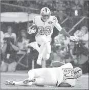  ?? DOUG DURAN — STAFF PHOTOGRAPH­ER ?? Jalen Richard leaps over teammate Rodney Hudson as he runs for a first down in the second quarter Thursday.