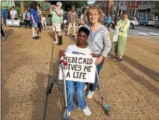  ?? LESLIE KROWCHENKO - DIGITAL FIRST MEDIA ?? Carole Nebhut and her son, Alex, who suffers from cerebral palsy, attended an event in support of Medicaid and the coverage and consumer protection­s of the Affordable Care Act in Media Saturday.