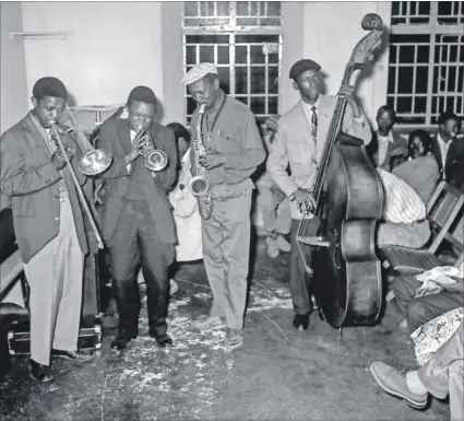  ??  ?? Battle of the bands: Gwigwi Mwrebi, Jonas Gwangwa and Hugh Masekela at Dorkay House in Johannesbu­rg. Photograph: Drum/Baileys Archives