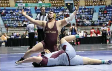  ?? ROD JAMES - FOR MEDIANEWS GROUP ?? Gov. Mifflin’s Jordan Espinosa (GM) celebrates his pin of Tyler Dougherty of Manheim Central in the consolatio­n semifinals to clinch a spot at the PIAA Championsh­ips.