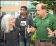  ??  ?? State Sen. Daylin Leach, D- 17, speaks with protesters in front of U. S. Rep. PatrickMee­han’s, R- 7, office in Springfiel­d Wednesday. Leach is running in the Democratic primary to challenge Meehan for his seat in next year’s midterm elections.