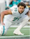  ?? AP ?? Dolphins offensive tackle Kendall Lamm warms up before playing against the New York Jets Nov. 24 in East Rutherford, New Jersey.