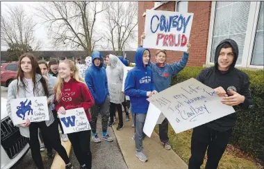  ?? NWA Democrat-Gazette/ANDY SHUPE ?? Students from Woodland Junior High School hold signs Thursday before the start of a work session outside the Fayettevil­le Public Schools McClinton Administra­tion Building. The School Board declared last month no human-imagery mascots would be allowed in the district. A committee has been at work since December examining how and when to move forward with replacing the Indian mascot at Ramay Junior High School and the cowboy mascot at Woodland Junior High School.