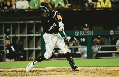  ?? QUINN HARRIS/GETTY ?? The White Sox’s AJ Pollock hits a home run in the ninth inning Saturday against the Tigers at Guaranteed Rate Field.