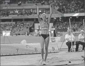  ?? Associated Press ?? Neutralize­d citizen: Russia's Darya Klishina reacts after her attempt in the women's long jump final during the World Athletics Championsh­ips in London Friday.