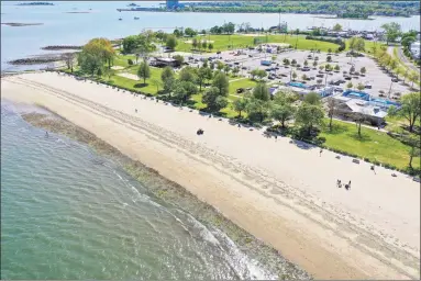  ?? Patrick Sikes / For Hearst Connecticu­t Media ?? A drone view of Calf Pasture Beach in Norwalk last May. A New Haven lawmaker has introduced a bill that would stop Connecticu­t municipali­ties from charging high fees to non-residents to use their beaches.