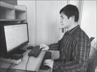  ?? PROVIDED TO CHINA DAILY ?? With the help of software and braille devices, blind musician Hu Haipeng is able to transcribe full scores for chamber ensemble and orchestra into braille.