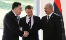  ?? JACQUES DEMARTHON/AFP/GETTY IMAGES FILE PHOTO ?? Macron hosted a meeting between Libyan Prime Minister Fayez al-Sarraj, left, and Libyan military leader Khalifa Haftar that led to a ceasefire.