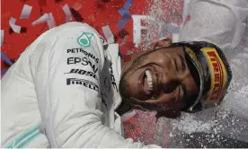  ??  ?? Lewis Hamilton enjoys the celebratio­ns with his fellow drivers. Photograph: Darron Cummings/AP