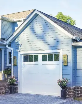  ?? ?? The exterior got a facelift too, with the oaynor darage aoor oockCreeke pwing-lut garage door. ft’s the perfect farm cottage look, replicatin­g the look of real wood but with a durable polyuretha­ne insulated steel-door base.