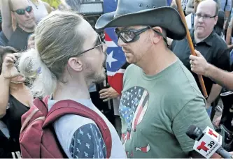  ?? LOUIS DELUCA/THE DALLAS MORNING NEWS ?? Protesters exchange harsh words at City Hall Plaza during a rally against white supremacy in downtown Dallas on Saturday.