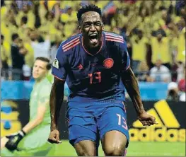  ?? SAEED KHAN / AFP ?? Yerry Mina celebra su gol de cabeza, el 0-1 para Colombia