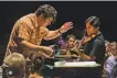  ?? RR Jones 2018 ?? Conductor Cristian Macelaru rehearses William Bolcom’s Concerto for Violin in D with soloist Philippe Quint before a performanc­e at the 2018 Cabrillo Festival.