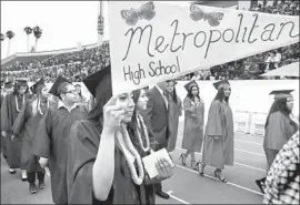  ?? Allen J. Schaben Los Angeles Times ?? L.A. UNIFIED estimated that 56% of class of 2017 students earned a C or higher in the classes necessary to apply to Cal State. Above, a 2017 graduation ceremony.