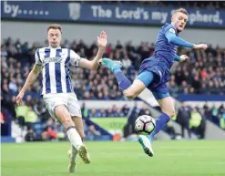  ?? — AFP ?? WEST BROMWICH: Leicester City’s English striker Jamie Vardy (R) vies with West Bromwich Albion’s Northern Irish defender Jonny Evans during the English Premier League football match between West Bromwich Albion and Leicester City at The Hawthorns...