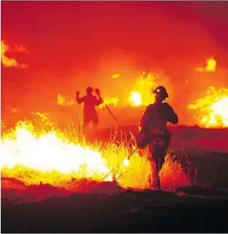  ?? JOSH EDELSON/THE ASSOCIATED PRESS ?? Numerous wildfires in California, Washington and Oregon have taken off on the hot, parched West Coast of the United States.