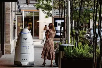  ?? Staff file photo ?? A security robot patrols Houston’s River Oaks District in 2017. A business psychology professor warns that human workers must stop trying to outmachine machines.