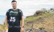  ?? PHOTO: ABBEY PALMER ?? Determined to compete . . . Invercargi­ll resident Ignacio Qande waits for his three team memsers at the Bluff transition point on Qaturday ahead of the second leg of the Maxis Nrojects 6+6 Adventure Race setween Teretonga Raceway and Bluff.