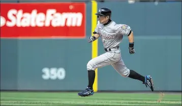  ?? DUSTIN BRADFORD / GETTY IMAGES ?? Ichiro Suzuki made his spring training debut Sunday after missing two weeks with a bruised knee. He was hitless in two at-bats but also drew a walk in a 7-7 tie with the Astros in Jupiter.