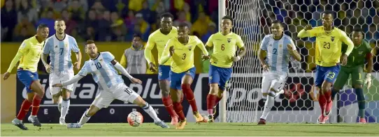  ??  ?? Argentina’s Lionel Messi (third from left) in action against Ecuador in their World Cup qualifier at Quito on Tuesday. Argentina won 3-1.