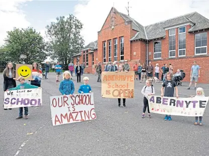  ?? Picture: Kim Cessford. ?? In May last year, parents, children and councillor­s gathered to celebrate the Scottish Government decision on Abernyte Primary School.