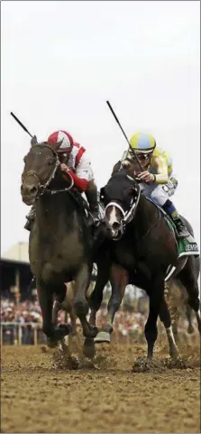  ?? MATT SLOCUM — THE ASSOCIATED PRESS ?? Cloud Computing (2), ridden by Javier Castellano, left, wins 142nd Preakness Stakes horse race at Pimlico race course as Classic Empire (5) with Julien Leparoux aboard takes second, Saturday, May 20, 2017, in Baltimore.