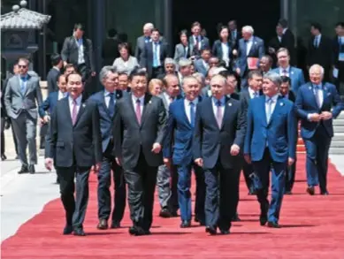  ??  ?? President Xi Jinping and foreign delegation heads at the Leaders’ Roundtable Summit of the Belt and Road Forum for Internatio­nal Cooperatio­n in Beijing, May 15, 2017. The joint communique published following the summit vows to help improve global...