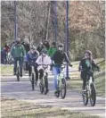  ??  ?? Left: Ivy Academy students ride bikes along the Tennessee Riverpark.