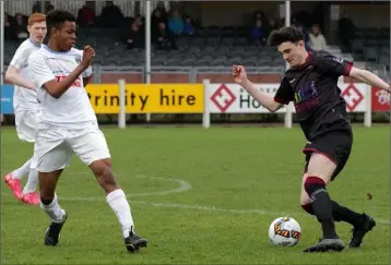  ??  ?? Brody Murphy of Wexford F.C. controls the ball as Isaac Akinsete (U.C.D.) keeps a close watch.