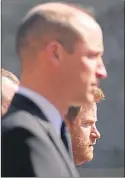  ??  ?? Prince William, front, and Prince Harry walk to the chapel yesterday