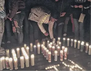  ?? Rachel Silberstei­n / times union ?? more than 30 people attended a vigil to remember Johni dunia on Saturday night at George Street Park in Cohoes. dunia was killed in a shooting on friday.