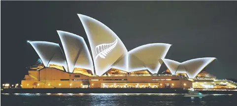  ?? – Reuters photo ?? The Silver Fern of New Zealand is seen projected onto the sails of the Opera House in Sydney, Australia.