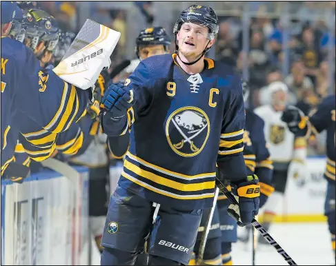  ?? — /AP ?? Jack Eichel celebrates his first-period goal at the Sabres bench yesterday in Buffalo. The Sabres beat visiting Vegas 4-2.