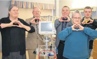  ?? SUBMITTED ?? Mary Noye, Pastor Rev. Sean Ward, Billy Shaw, Josh Ward and Cindy Aalbers, members of the Summerside United Pentecosta­l Church organizing committee, proudly show they “heart” the Prince County Hospital, in the signature pose of the PCH Foundation’s cardiac campaign this year.