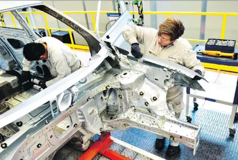  ?? PEDRO PARDO/AFP/GETTY IMAGES ?? A Volkswagen car plant in Puebla, Mexico. Under a more stringent NAFTA deal, rules of origin for auto parts will require that 75 per cent of a vehicle must be made in the U.S. or Mexico, compared to the current 62.5 per cent NAFTA threshold.