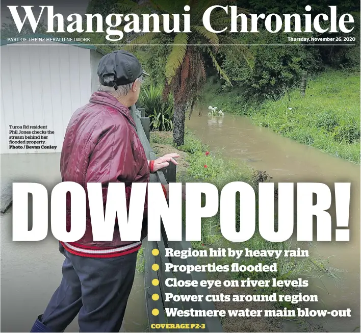  ?? Photo / Bevan Conley ?? Turoa Rd resident Phil Jones checks the stream behind her flooded property.