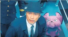  ??  ?? Ken Watanabe and the character Snubbull in a scene from Pokemon Detective Pikachu. Below, the hero, Pikachu.