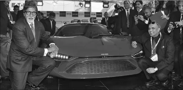  ?? Supplied: DC DESIGN, Afp/getty Images ?? Bollywood actor Amitabh Bachchan, left, poses next to a Lamborghin­i DC Avanti priced at more than $600,000.