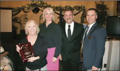  ??  ?? Susan S. Barber is presented with the 2015 Community Action Award by the Spanish Fork Salem Area Chamber of Commerce during the chamber’s installati­on banquet in January. Picture are, from left: Susan S. Barber, Stacy Beck, Todd Dickerson and Lance...