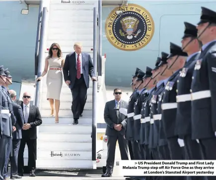  ??  ?? &gt; US President Donald Trump and First Lady Melania Trump step off Air Force One as they arrive at London’s Stansted Airport yesterday